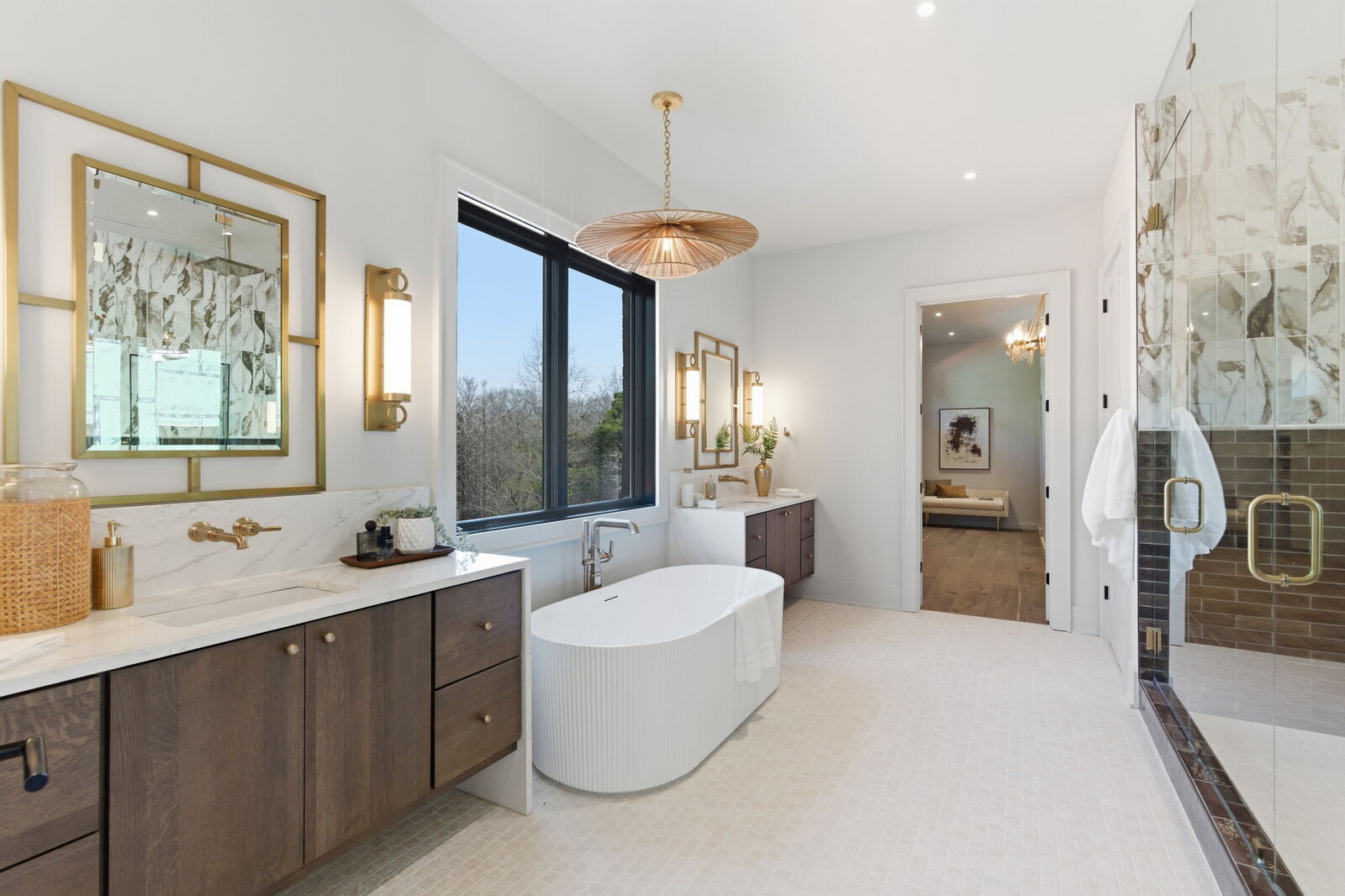 Primary bath with double vanity and freestanding soaking tub in a Mark Lynn Design home, Middle Tennessee