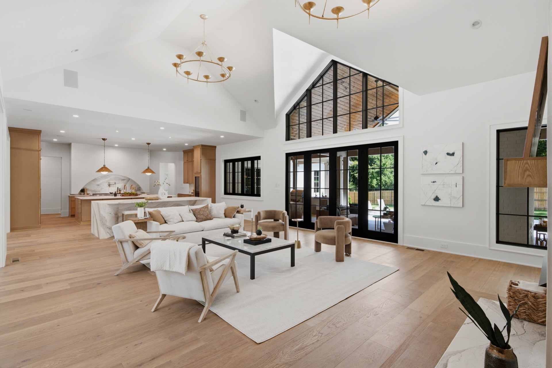 Vaulted great room with black steel window wall and open kitchen, custom Nashville home — Mark Lynn Design, built by Broadway Builders
