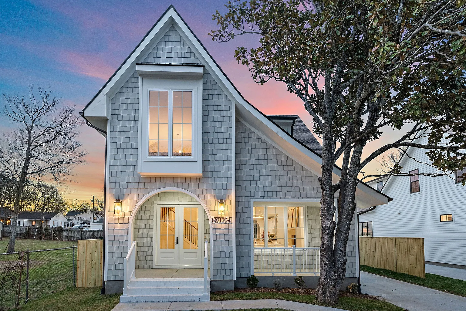 Gray shingle residence at dusk, Nashville TN