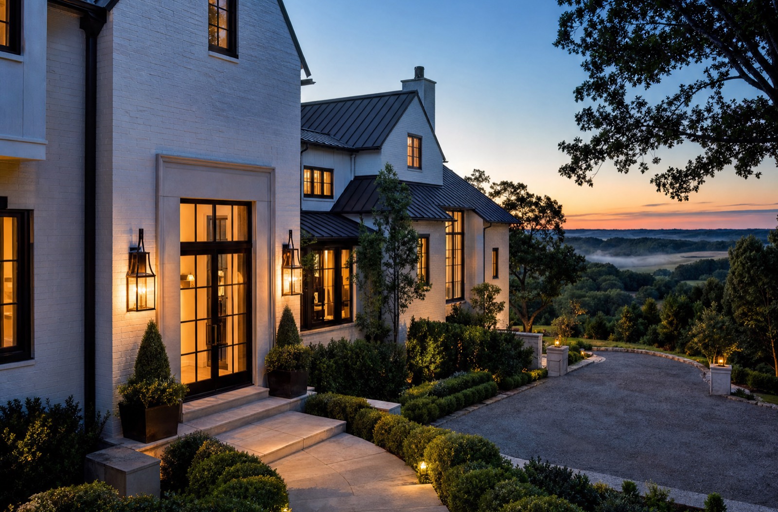 Twilight rendering of a white brick estate with gas lanterns overlooking a misty Tennessee valley — Mark Lynn Design